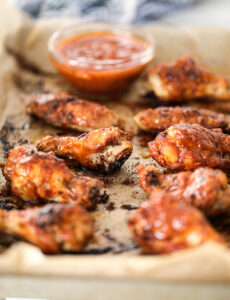 Side view of Pumpkin Marinara Wings with dipping sauce